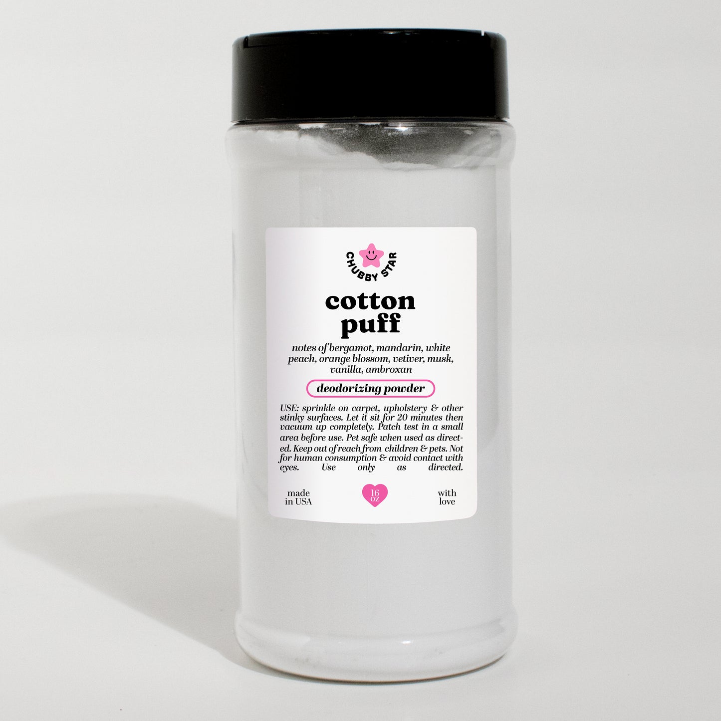 A clear plastic jar of Cotton Puff PDM Valaya scented deodorizing powder with a black lid and a white label, set against a plain white background.