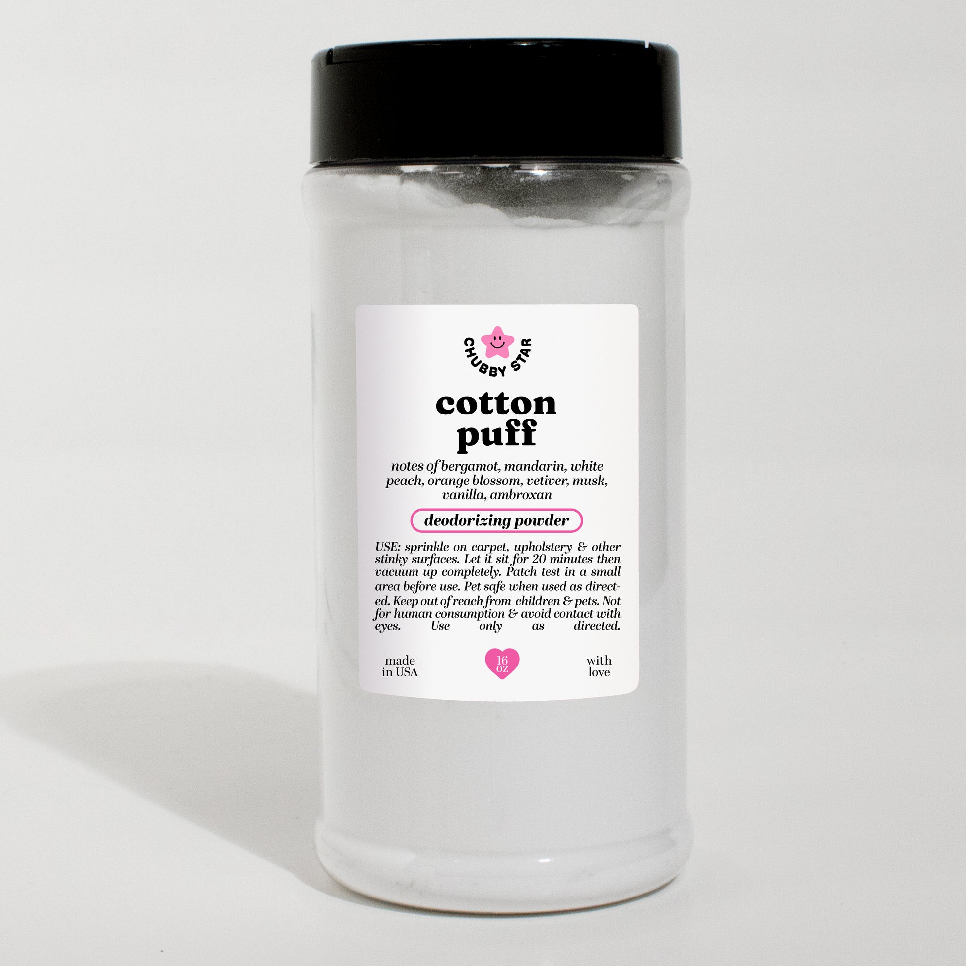 A clear plastic jar of Cotton Puff PDM Valaya scented deodorizing powder with a black lid and a white label, set against a plain white background.