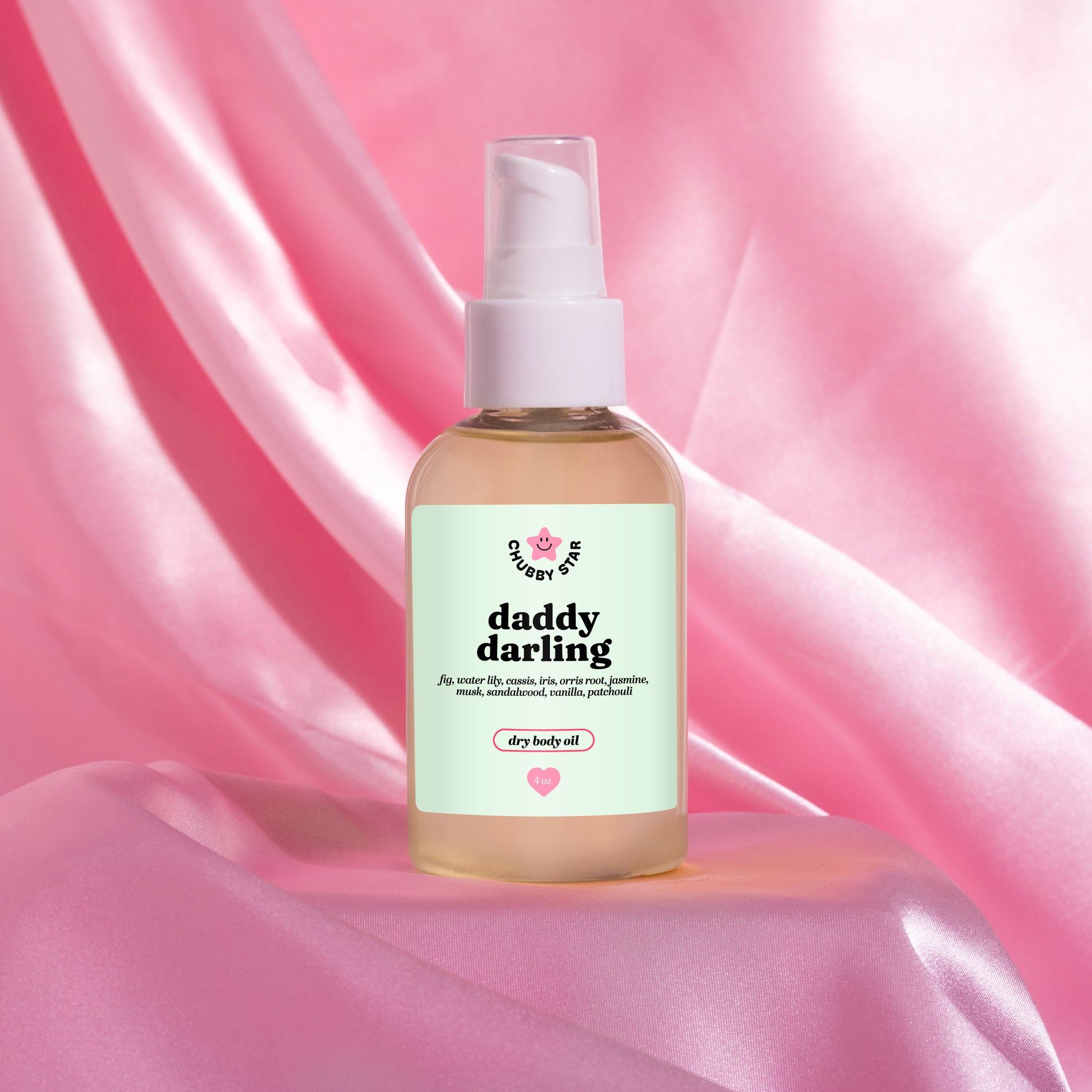 daddy darling father figure scented body oil on a pink background