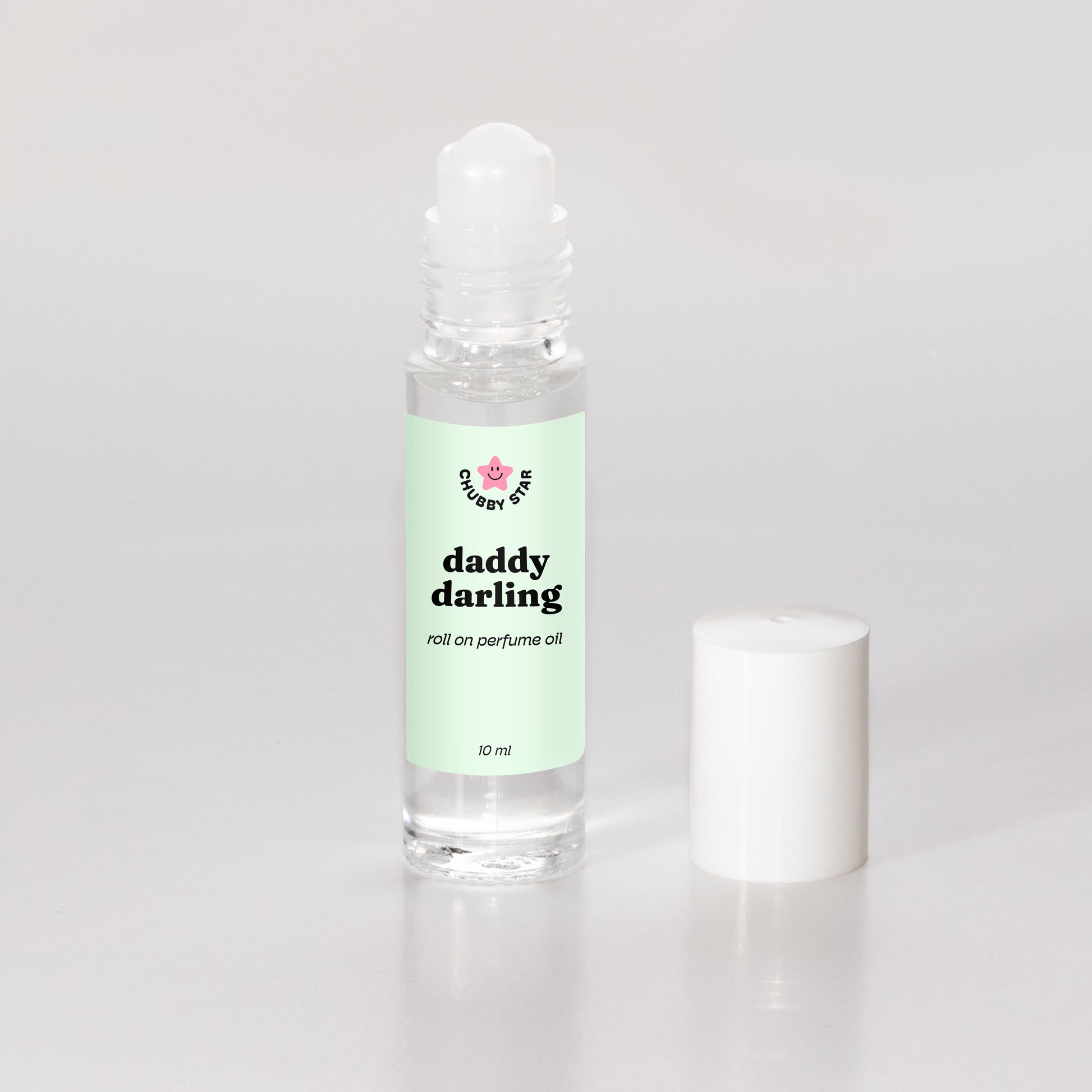 daddy darling father figure scented roll on perfume oil on a white background