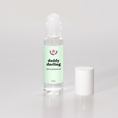 daddy darling father figure scented roll on perfume oil on a white background
