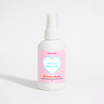 A white plastic spray bottle of Chubby Star Miami Squeeze Miami Nectar scented hair & body milk spray with a pink label, set against a plain white background.