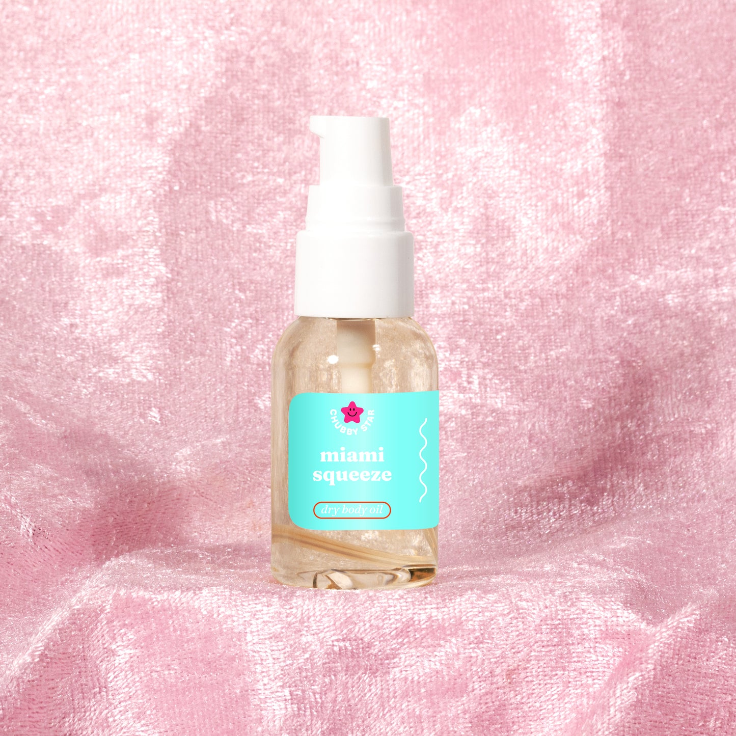 Miami Squeeze, a Miami Nectar dupe, scented 1 oz body oil mini on a pink background 