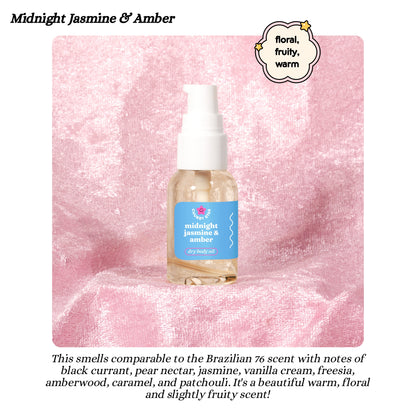 Bottle of 'Midnight Jasmine & Amber' body oil on a pink textured background