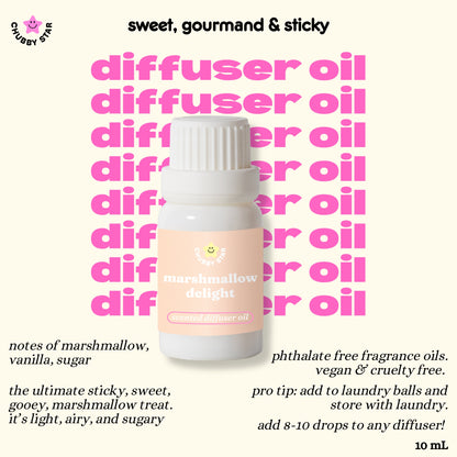 A 10 mL bottle of 'marshmallow delight' scent diffuser oil by Chubby Star, set against a pale cream background with pink text repeating 'diffuser oil' and black text describing the notes and benefits of the fragrance oil.