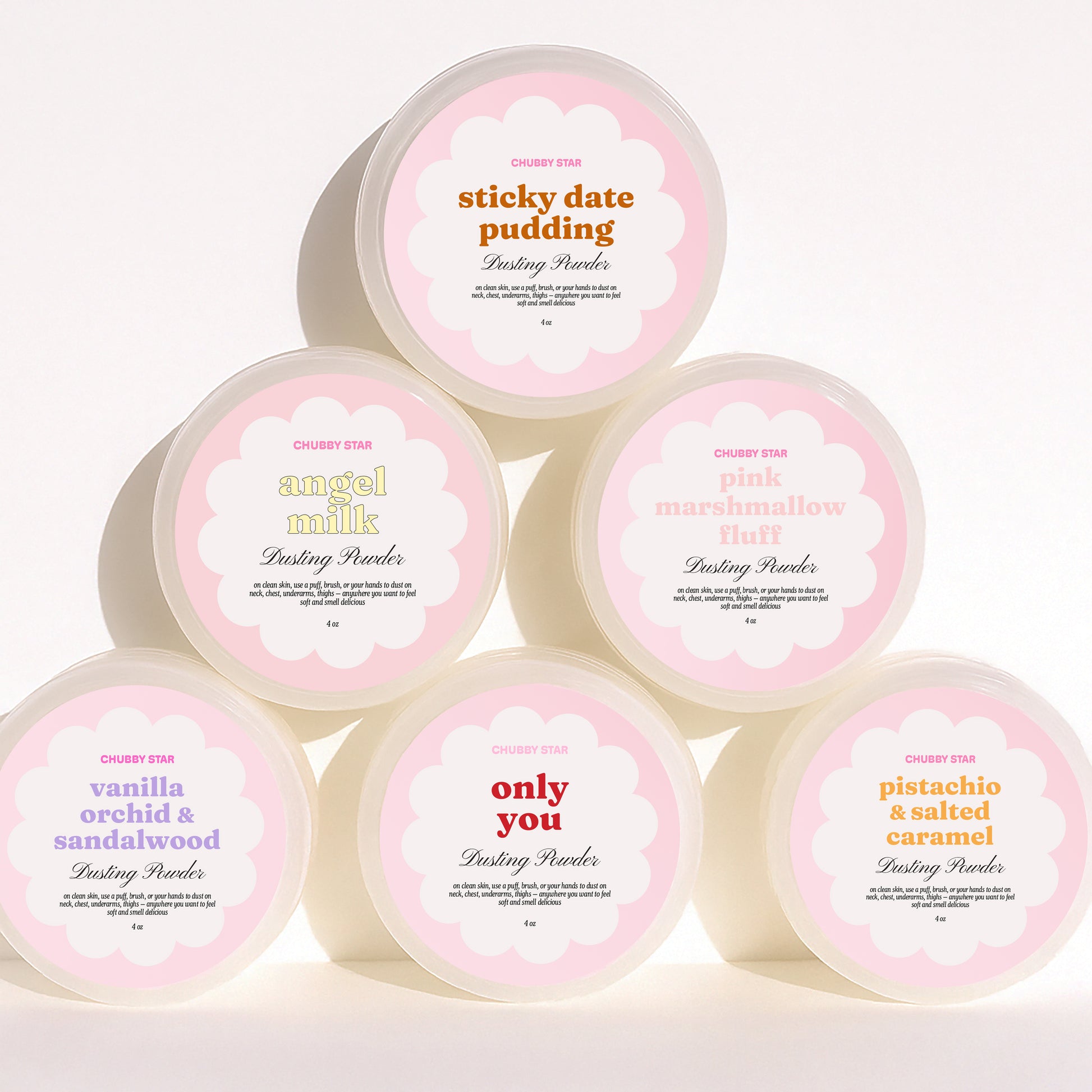 Set of eight containers of different scented dusting powders for your body with visible labels on a white background, made by chubby star fragrances