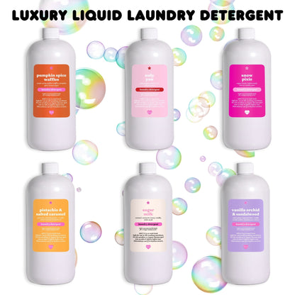 A collection of bottles of scented liquid laundry detergent with bubbles in the background. The bottles come in various colors representing different scents.