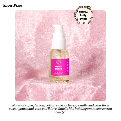 Snow Pixie dry body oil bottle on a pink textured background with product description text.