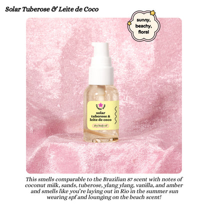 Bottle of Solar Tuberose & Leite de Coco dry body oil on a pink textured background